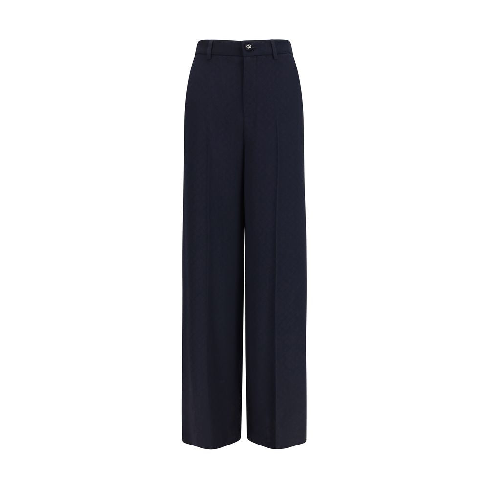 Pantalon casual en viscose bleu de Gucci, coupe décontractée avec ceinture à boucle, visible sur fond neutre.