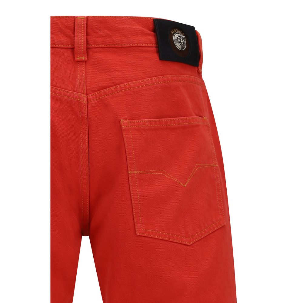Jeans droits en coton multicolore de Versace, design élégant avec coupe classique et détails colorés.