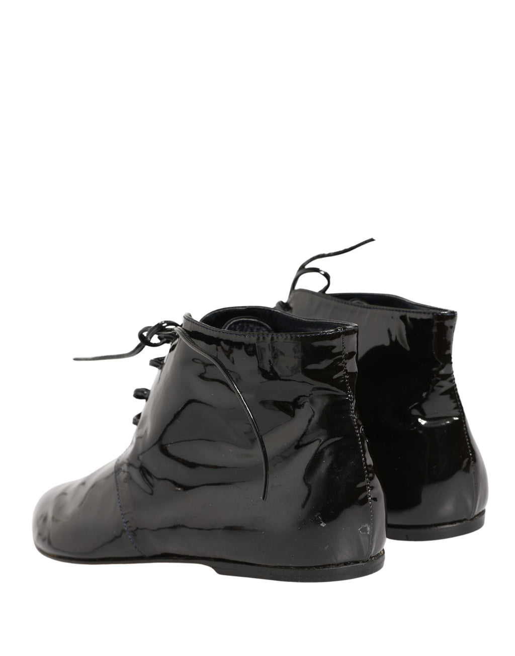 Chaussures bottines en cuir noir Dolce & Gabbana, élégantes et modernes, visibles avec lacets et semelle en cuir.