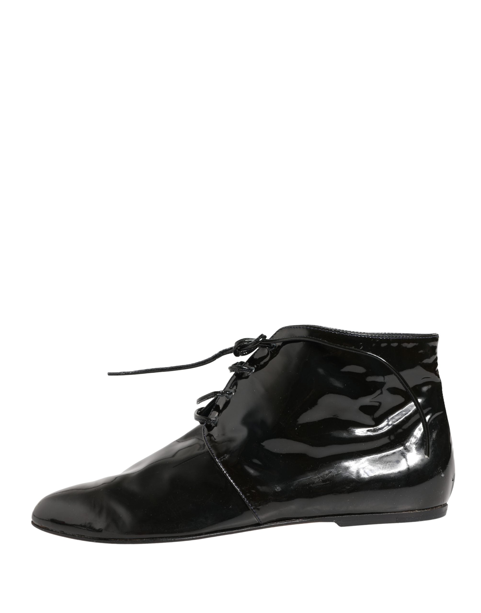 Chaussures bottines en cuir noir Dolce & Gabbana pour femme, élégantes et sophistiquées, visibles en gros plan sur fond neutre.
