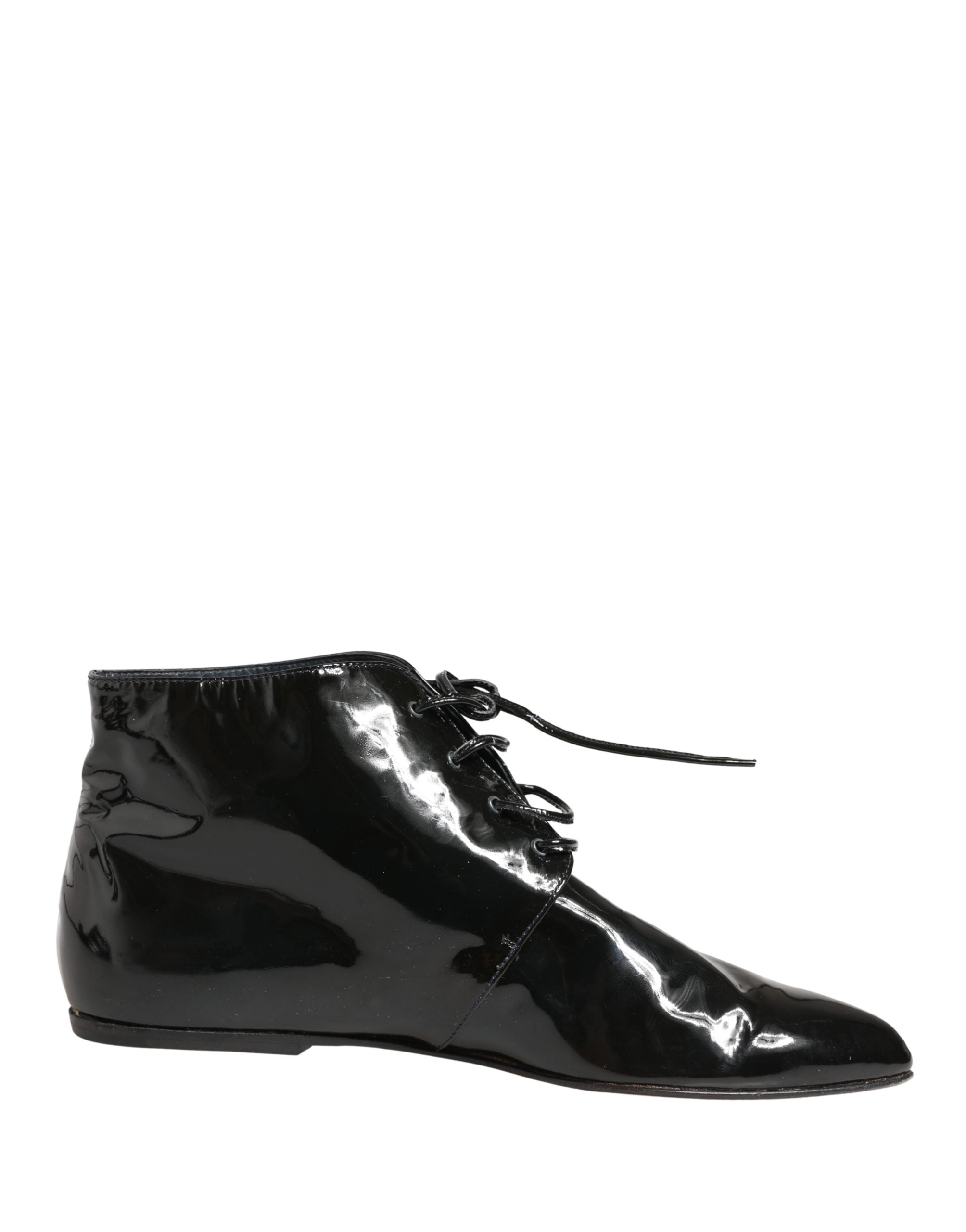 Chaussures bottines en cuir noir Dolce & Gabbana pour femme, élégantes et sophistiquées, visibles sous différents angles.