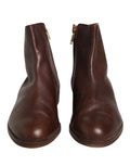 Chaussures Dolce & Gabbana en cuir marron, baskets plates de moto, bottines élégantes pour femme, visibles de face.