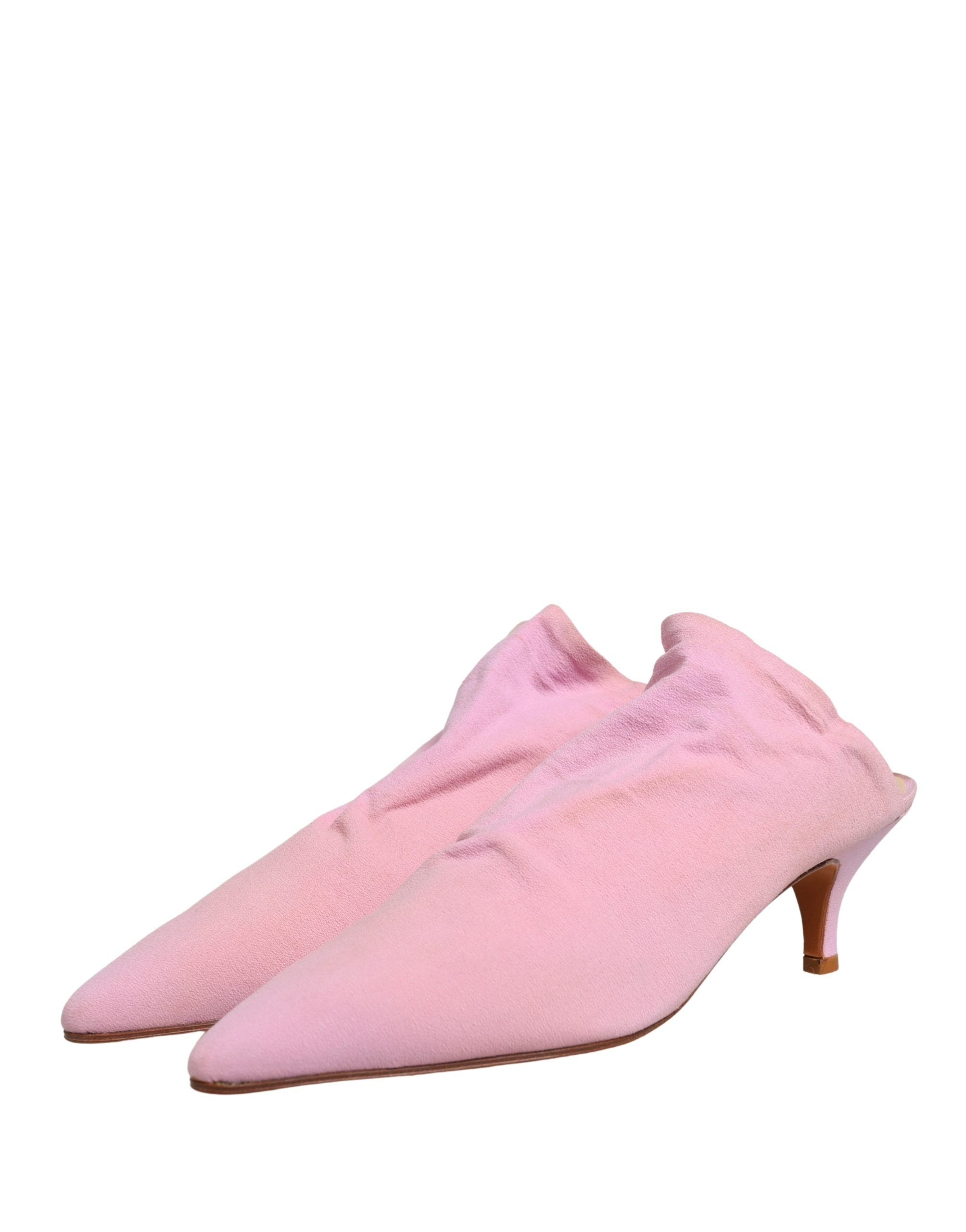Escarpins mules en daim rose de Dolce & Gabbana avec talon élégant et design sophistiqué.