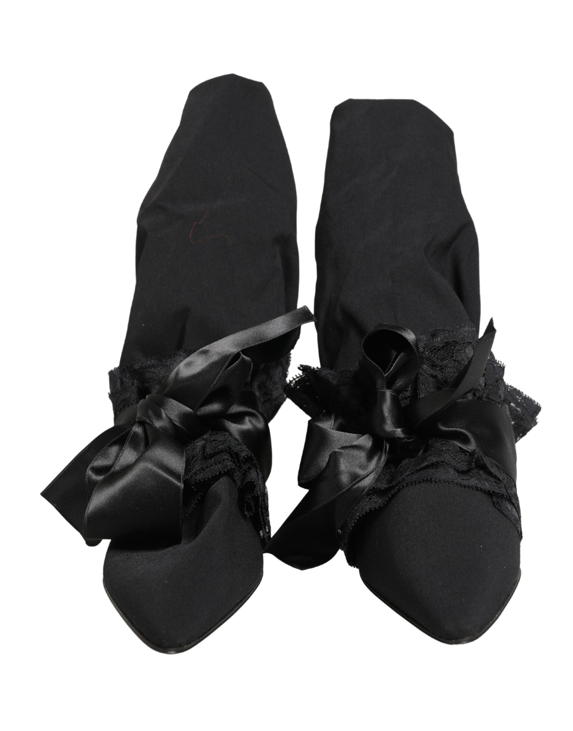 Bottes en daim noir Dolce & Gabbana mi-mollet, élégantes et sophistiquées, visibles avec la tige mi-mollet et le design en daim.