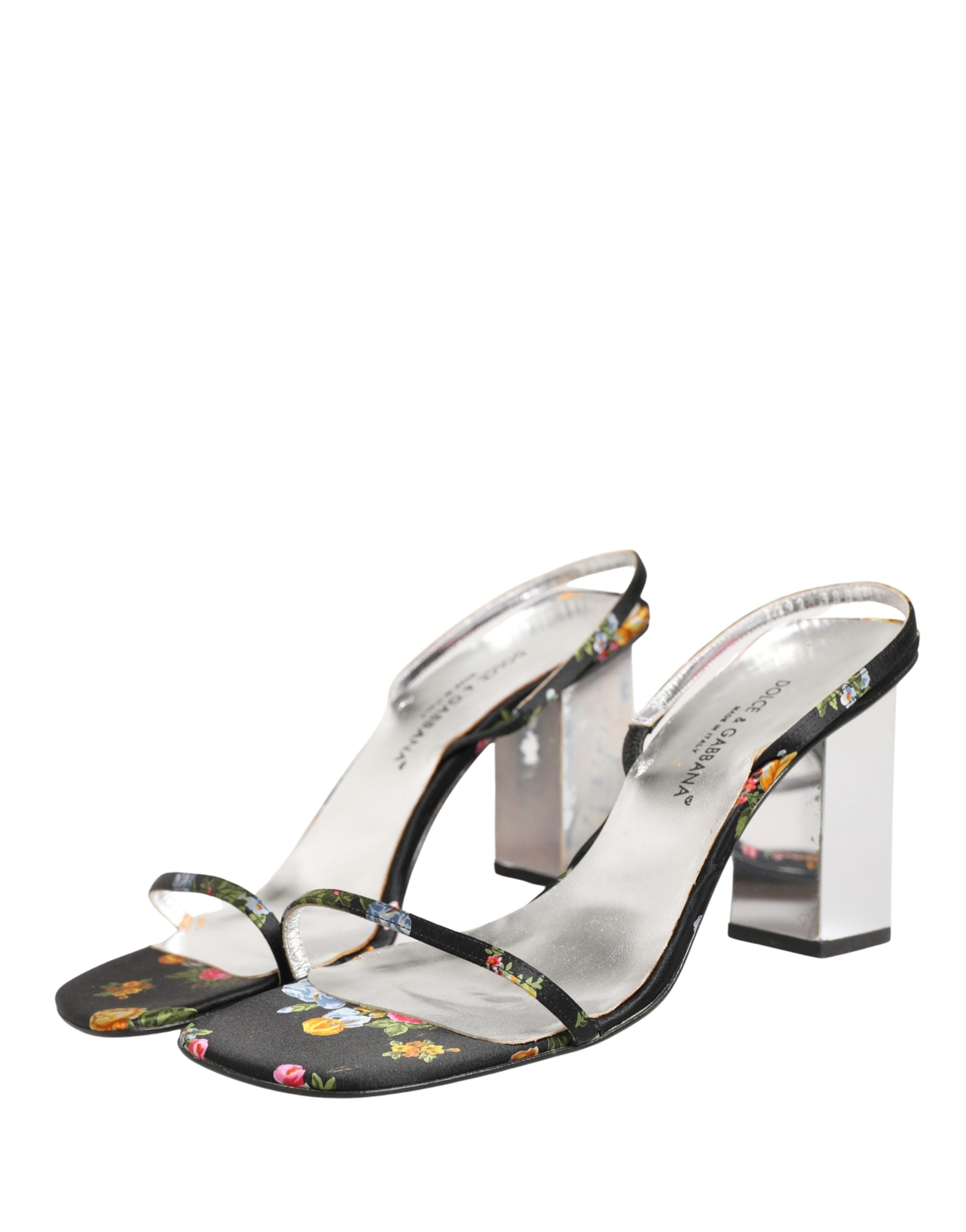 Sandales à talons Dolce & Gabbana noires et argentées avec motif floral, semelle en bloc et design élégant.