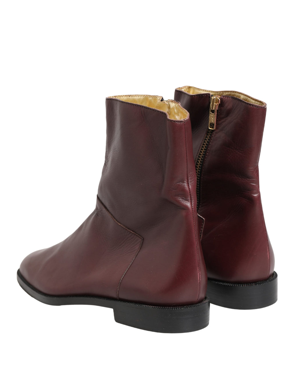 Chaussures Dolce & Gabbana, bottines plates en cuir marron biker à la cheville avec boucle et détails élégants.