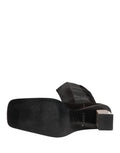 Bottes en cuir suédé noir Dolce & Gabbana, mi-mollet, avec talons pour femmes, vues de face sur fond neutre.