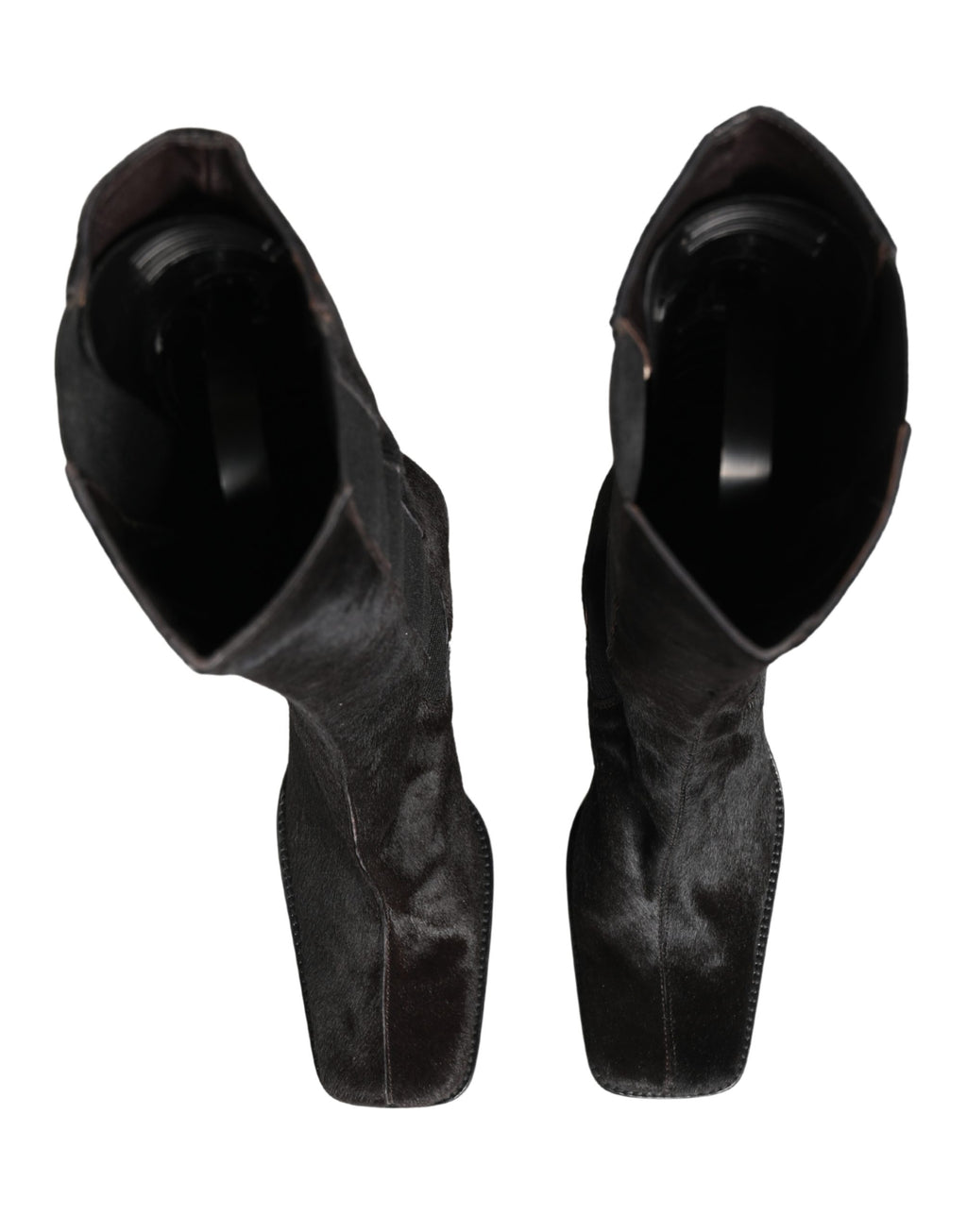 Bottes noires en cuir suédé Dolce & Gabbana, hautes jusqu’au genou, avec talon élégant et design sophistiqué.