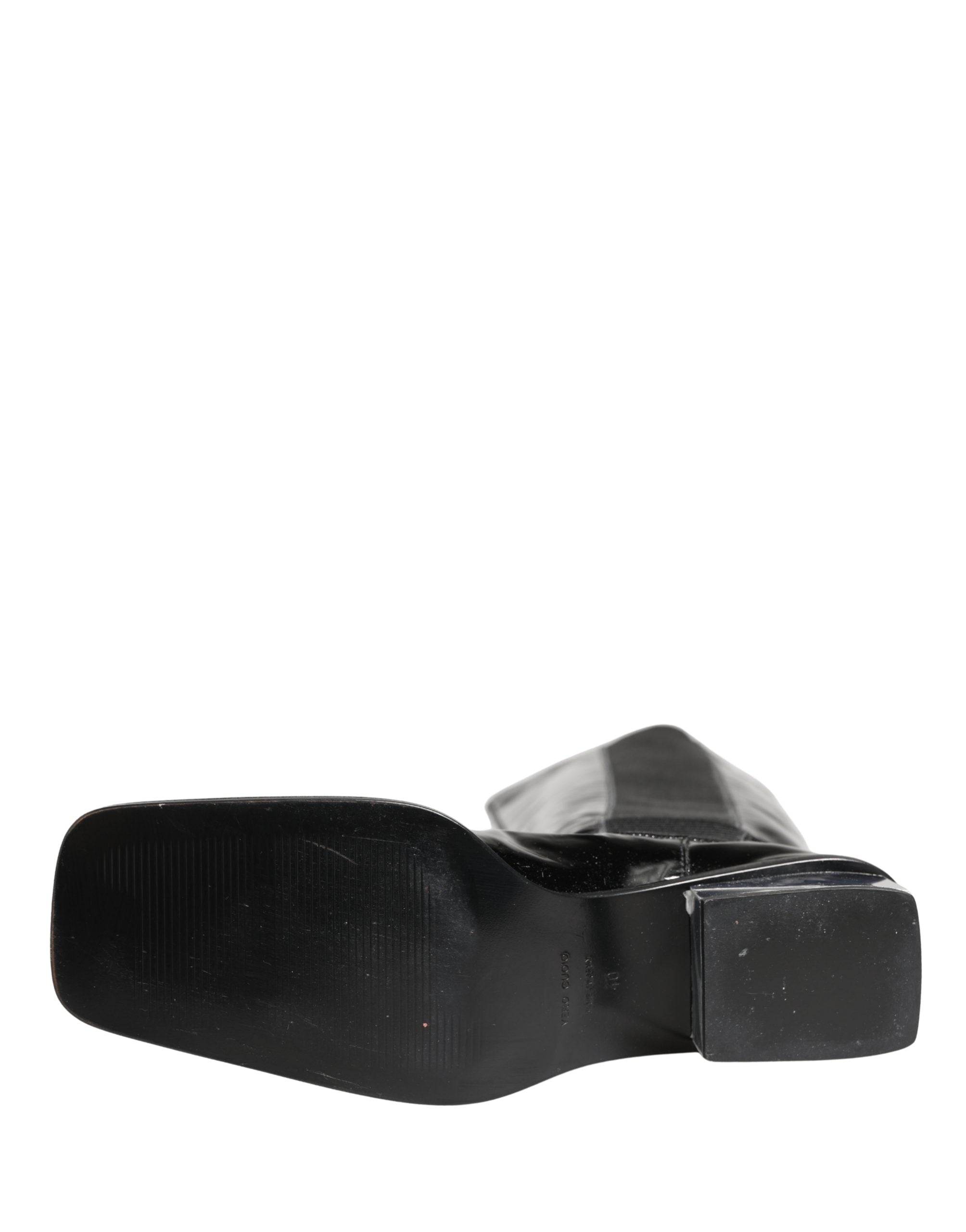 Bottes hautes en cuir verni noir Dolce & Gabbana, chaussures élégantes en cuir brillant, style sophistiqué et moderne.