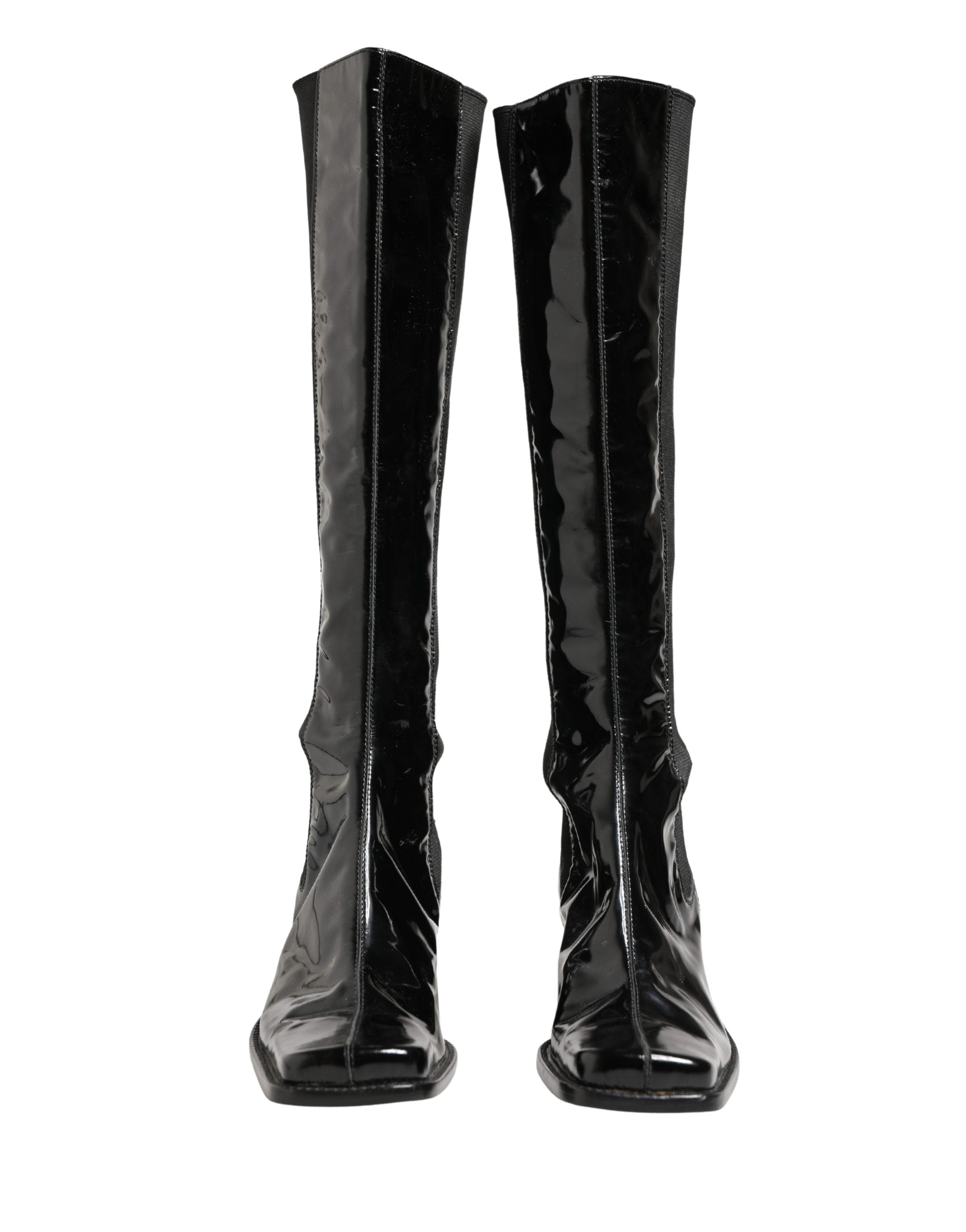 Bottes hautes en cuir verni noir de Dolce & Gabbana, chaussures élégantes en cuir patiné brillant.