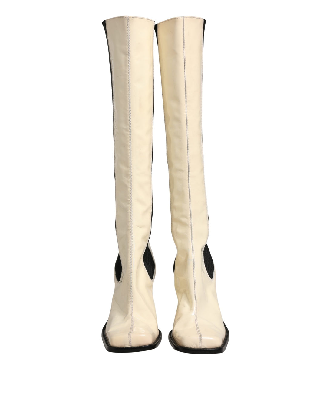 Bottes hautes en cuir blanc et noir de Dolce & Gabbana, chaussures élégantes et sophistiquées.