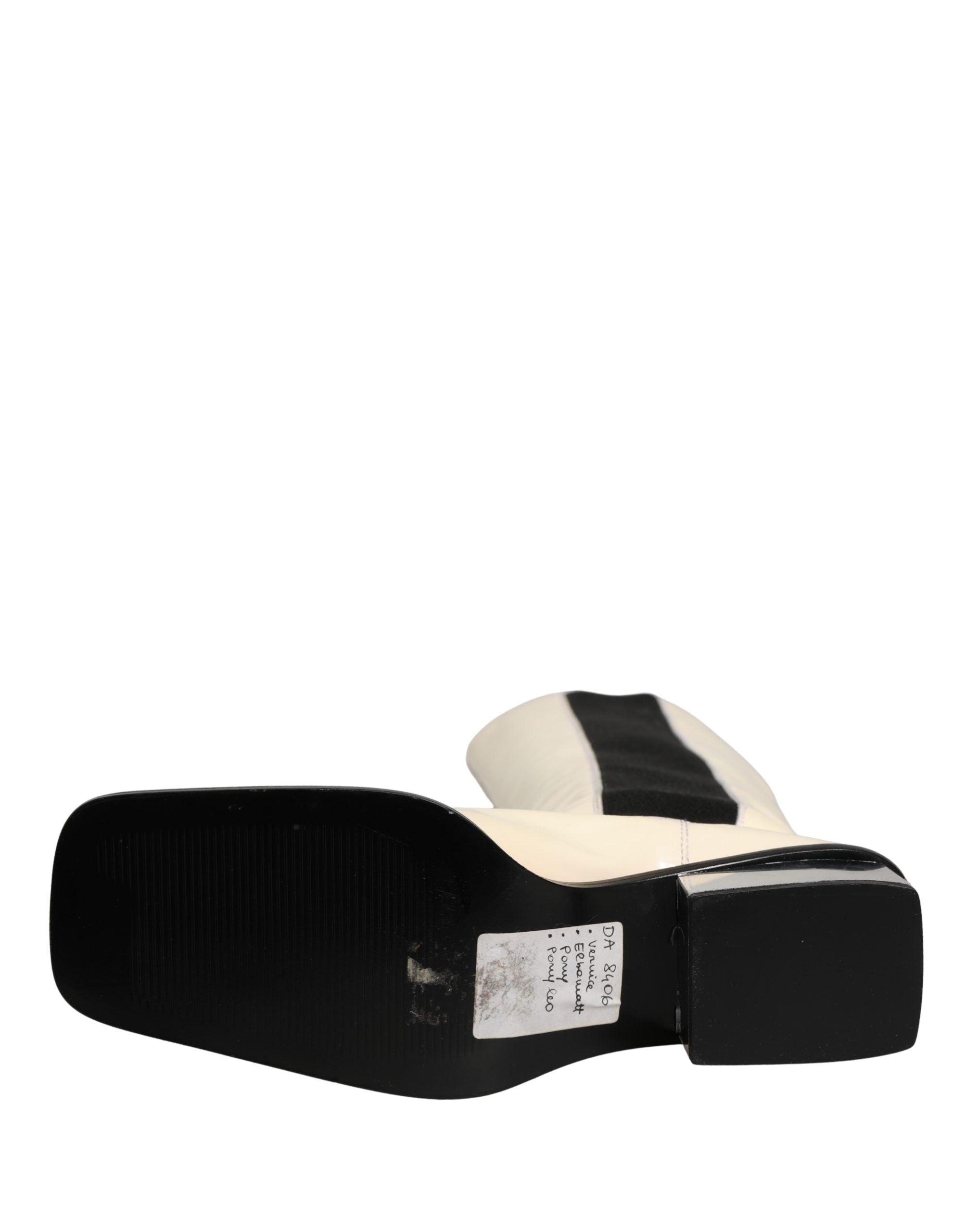 Bottes hautes en cuir blanc et noir de Dolce & Gabbana, chaussures élégantes pour femmes.