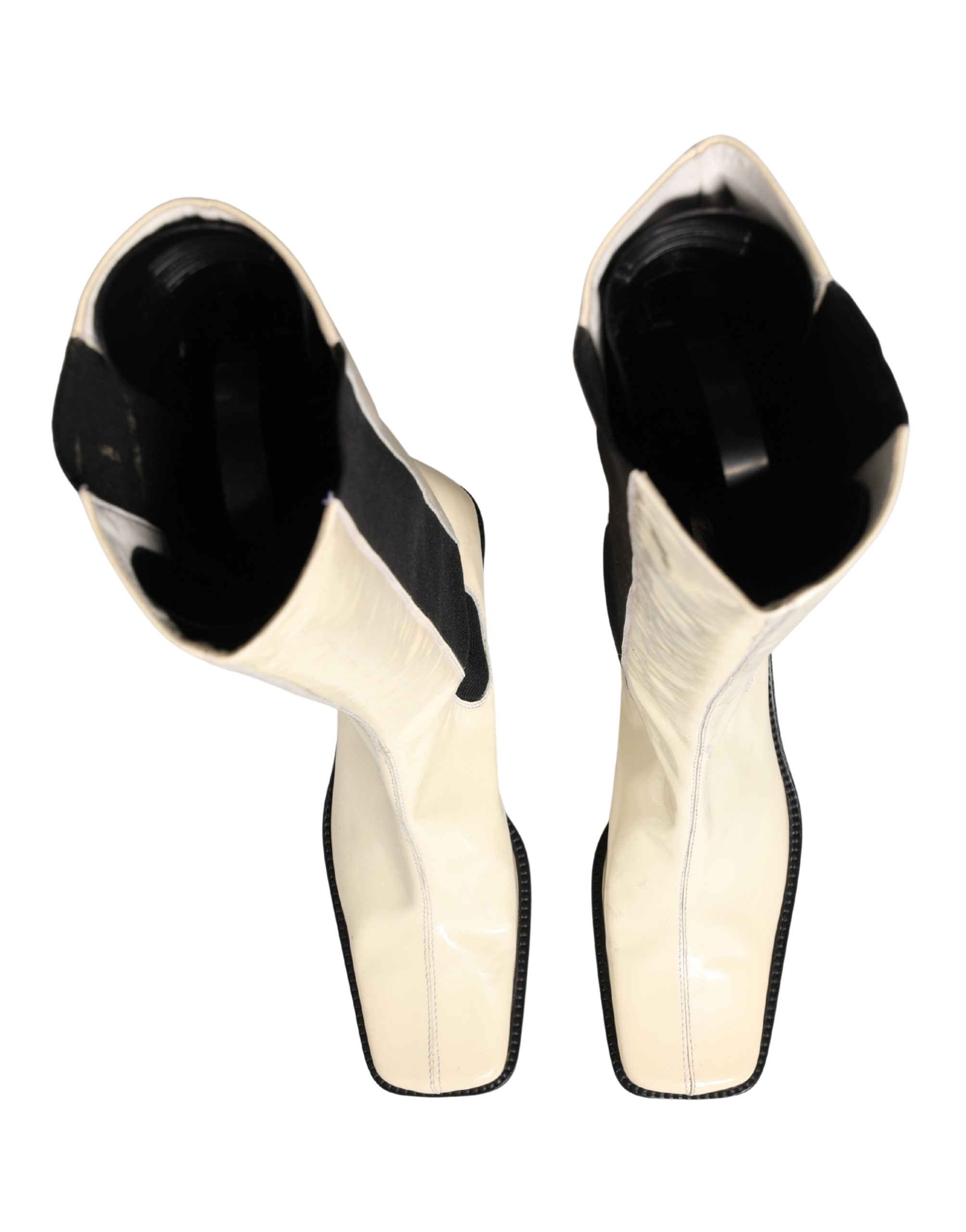 Bottes en cuir noir et blanc Dolce & Gabbana, cuissardes élégantes avec semelle en cuir, chaussures à talons hauts.