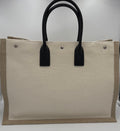 Sac cabas grand Saint Laurent Rive Gauche en cuir, noir, avec logo emblématique et poignées en cuir.
