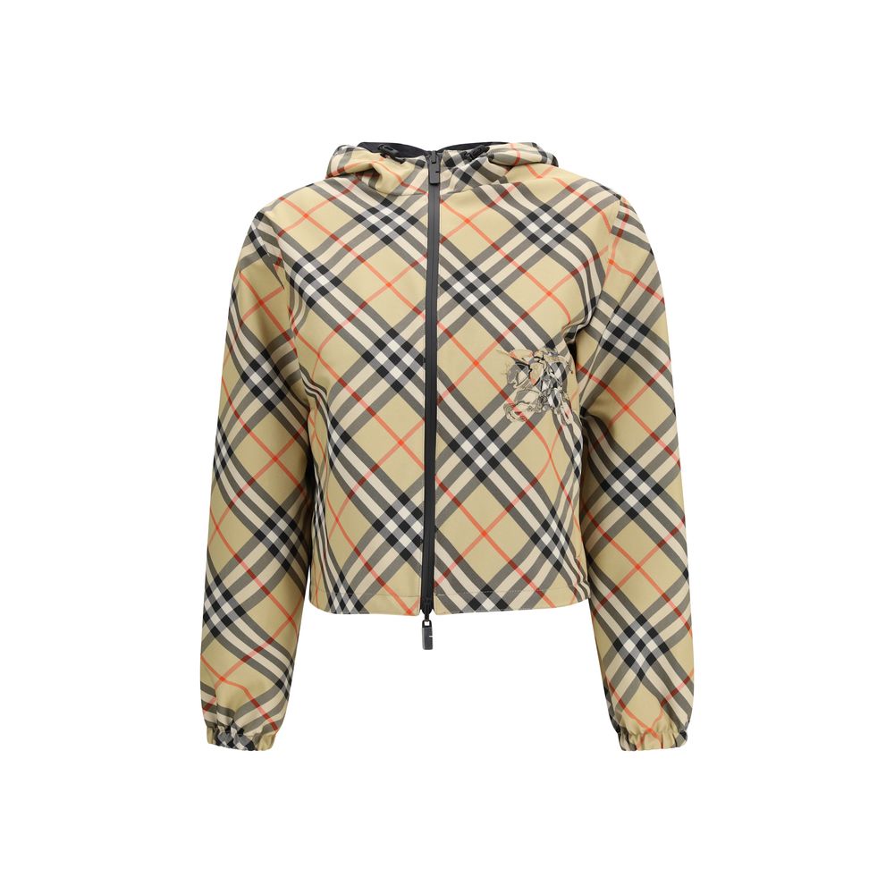 Veste longue beige en polyester de Burberry, coupe élégante et classique, portée sur un fond neutre.