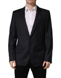 Manteau homme noir en laine Dolce & Gabbana, coupe slim, veste blazer élégante avec col classique et fermeture boutonnée.