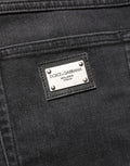 Jeans skinny en coton noir Dolce & Gabbana, coupe régulière, style denim ajusté, visible avec détails classiques.