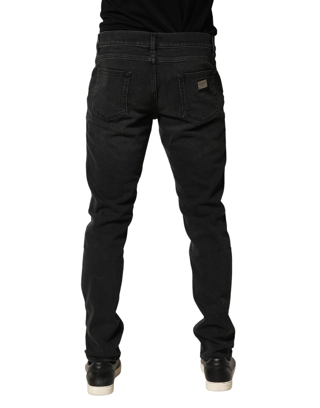 Jeans skinny en coton stretch noir de Dolce & Gabbana, coupe régulière, denim élégant visible sur l'image.