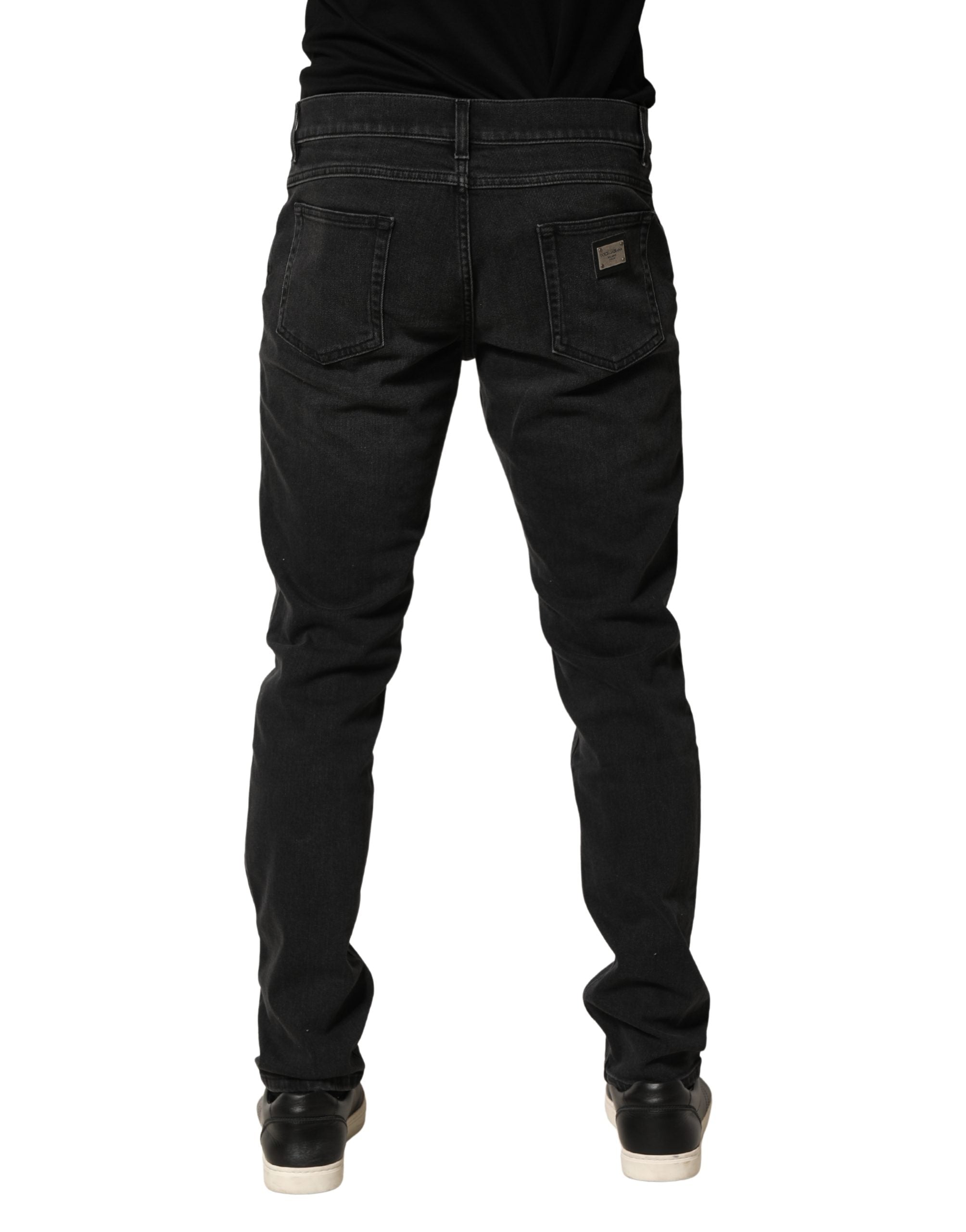 Jeans skinny en coton stretch noir de Dolce & Gabbana, coupe régulière, denim élégant visible sur l'image.