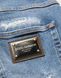 Shorts bermuda en denim bleu déchiré de Dolce & Gabbana, coton, style décontracté et tendance pour hommes.