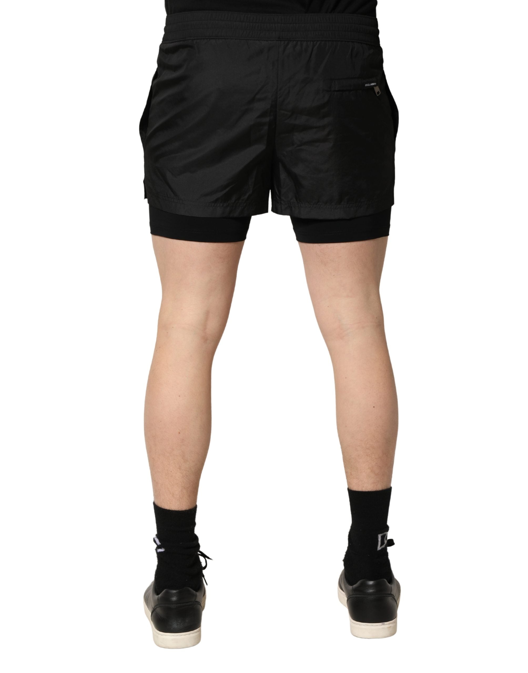 Shorts de bain pour hommes Dolce & Gabbana en polyester noir avec cordon de serrage, style élégant et confortable.