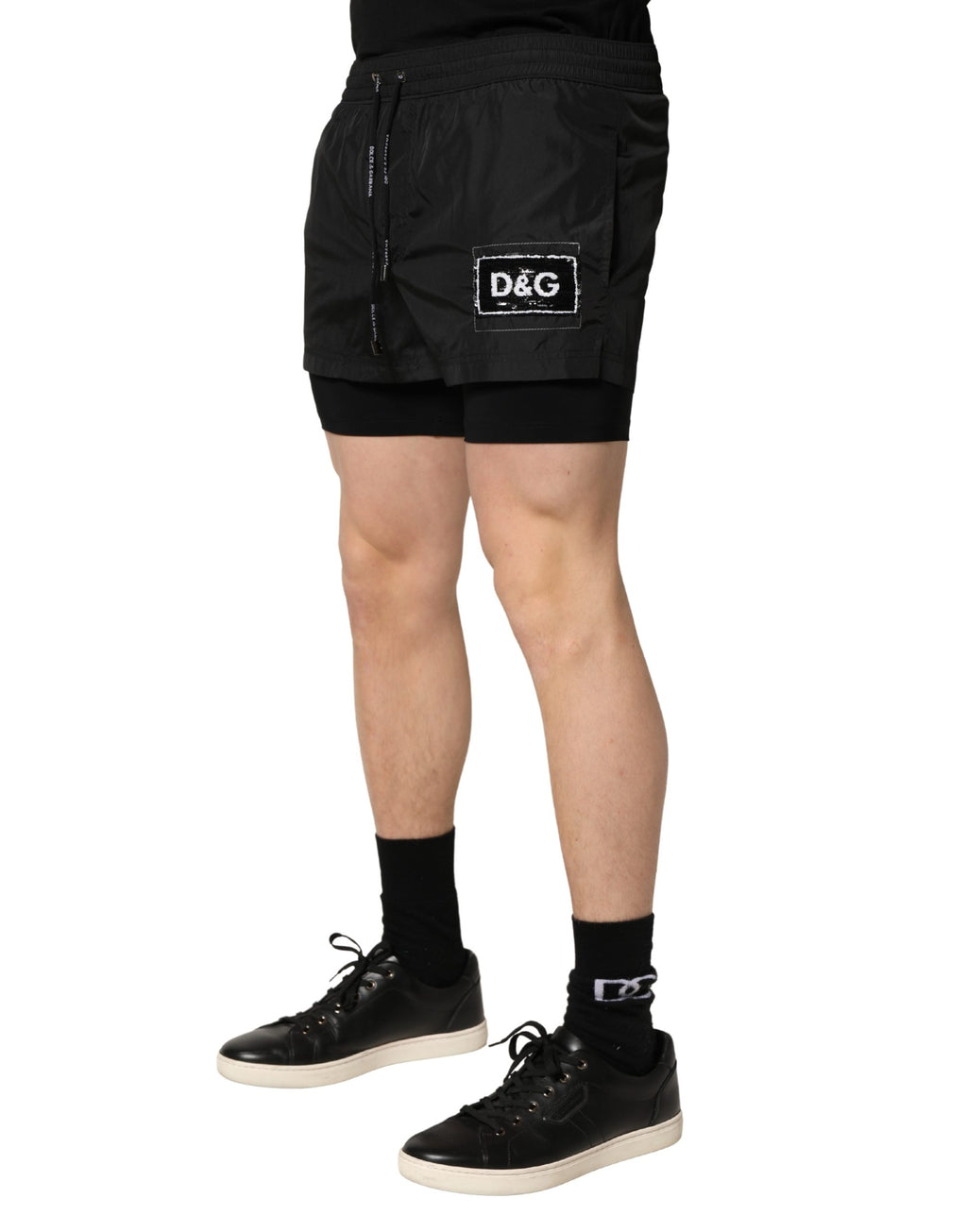 Shorts de bain pour homme Dolce & Gabbana en polyester noir avec cordon de serrage, style décontracté et élégant.