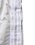 Shorts de bain homme en polyester argenté avec cordon de serrage de la marque Dolce & Gabbana, vue de face.