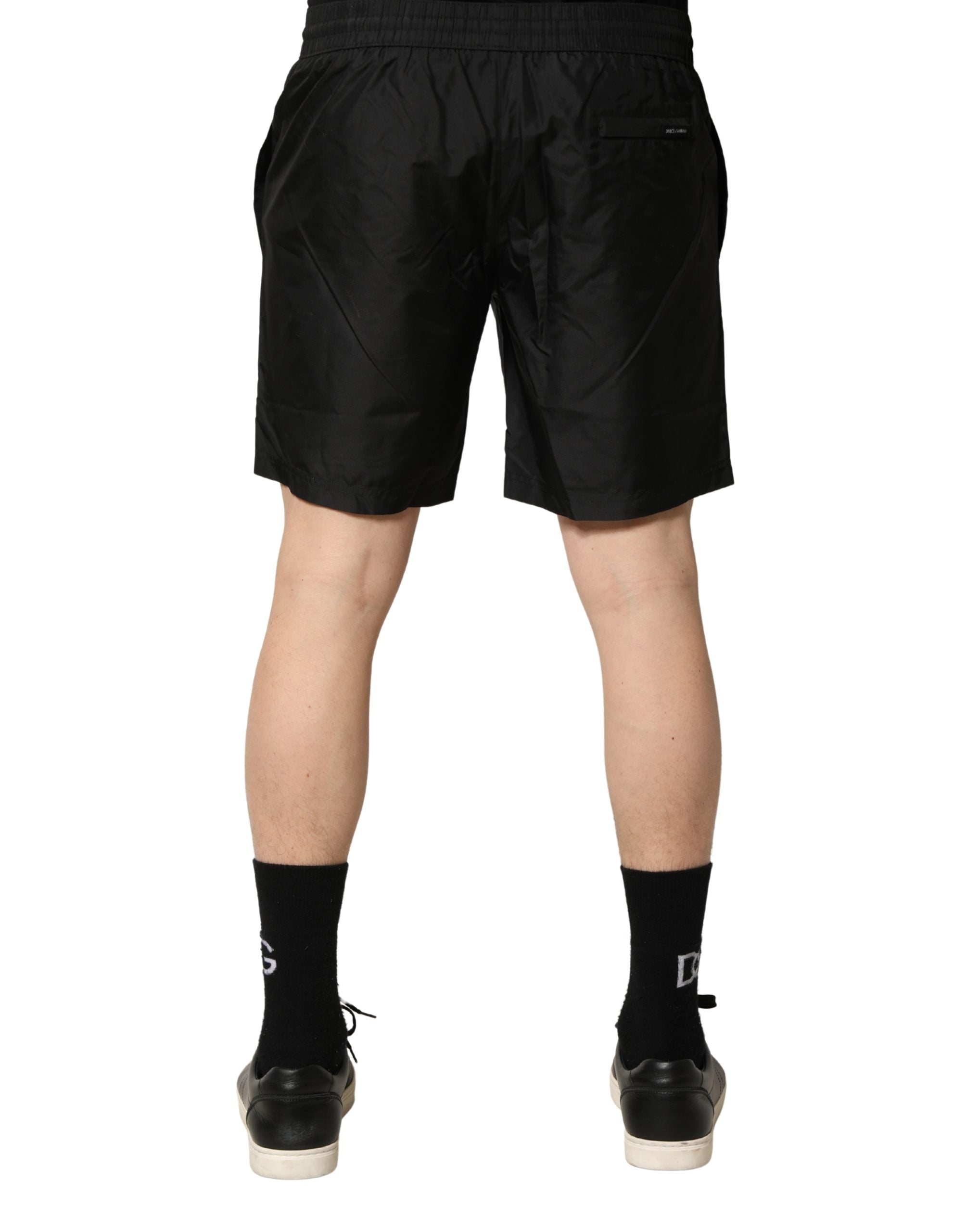 Shorts de bain homme Dolce & Gabbana en polyester noir avec cordon de serrage, style décontracté et confortable.