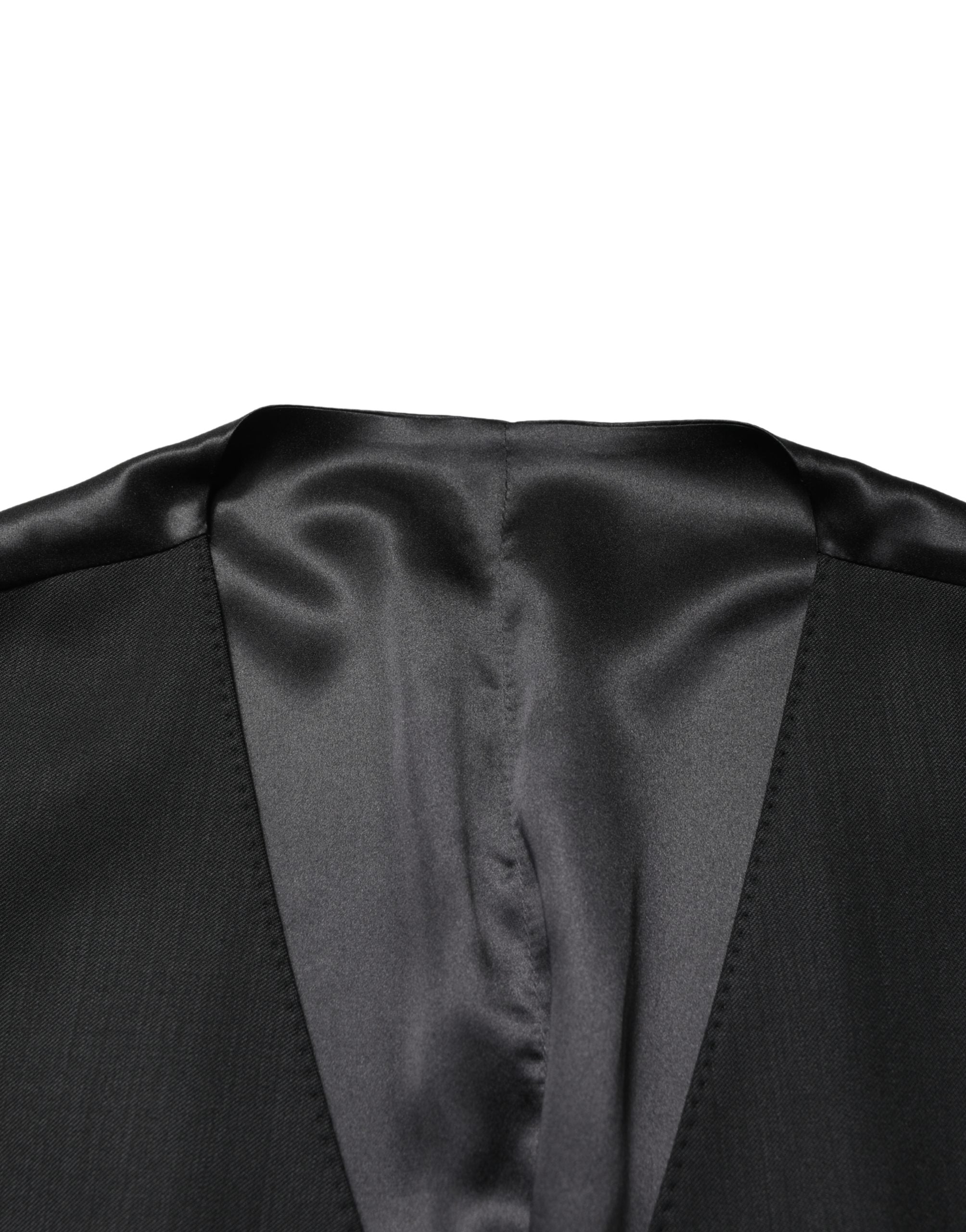 Gilet homme en laine noire Dolce & Gabbana à boutonnière simple, détail élégant et coupe ajustée.