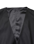 Gilet homme Dolce & Gabbana en laine noire, à simple boutonnage, élégant et classique, porté sur un fond neutre.