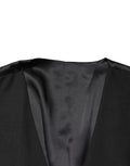 Gilet homme en laine noire Dolce & Gabbana à col châle, coupe simple, fermoir à boutons sur l'avant.