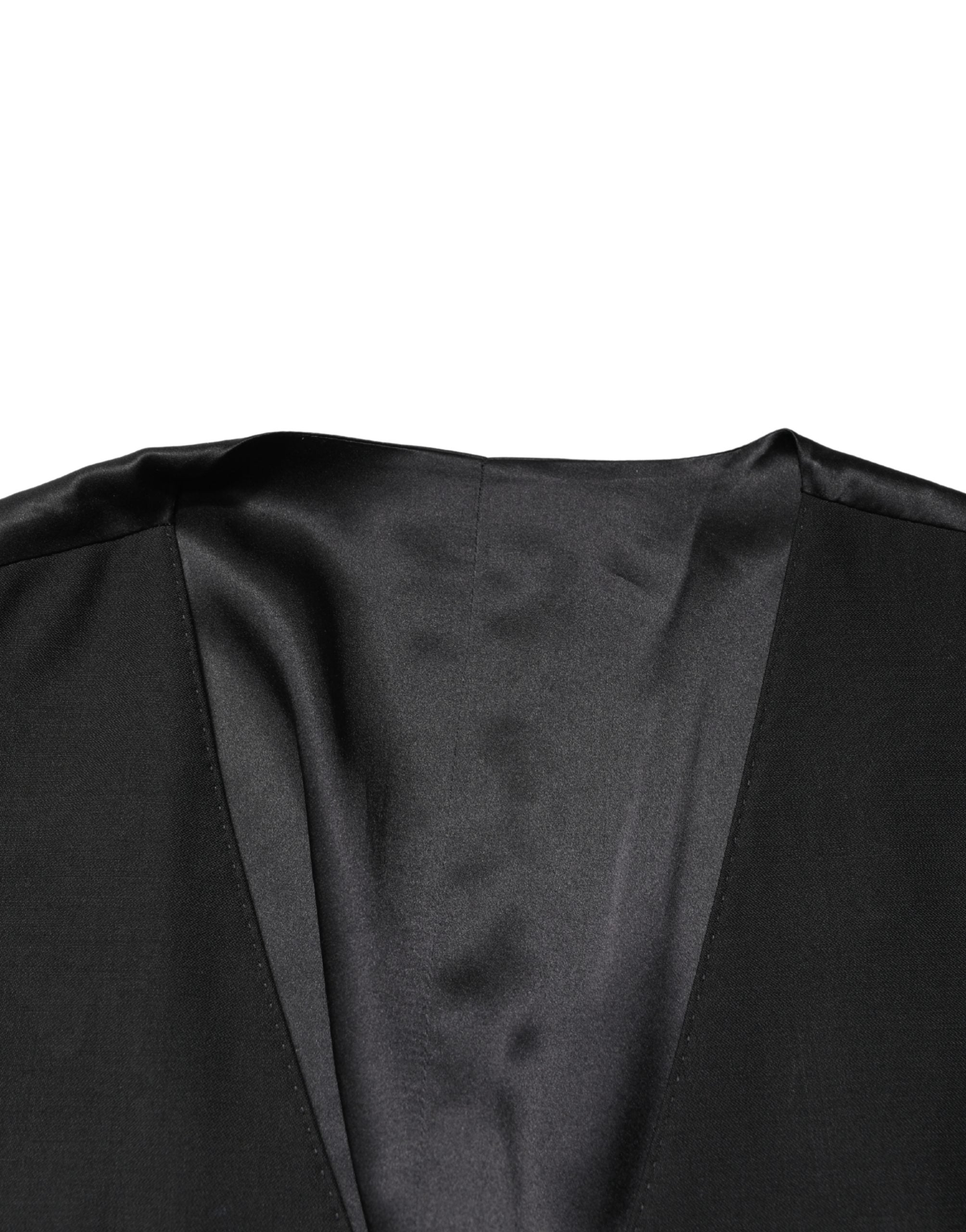 Gilet homme en laine noire Dolce & Gabbana à col châle, coupe simple, fermoir à boutons sur l'avant.