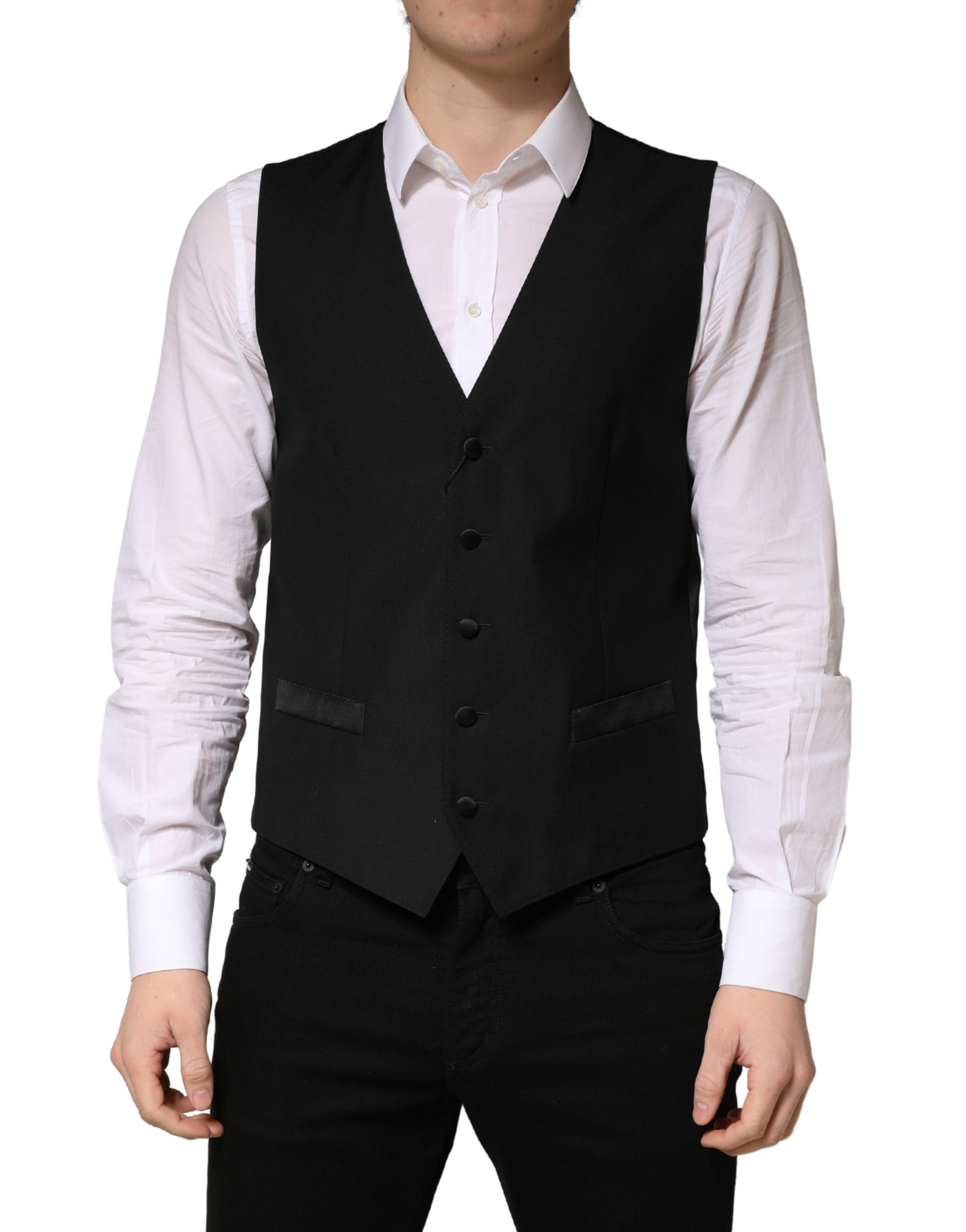 Gilet homme en laine noire Dolce & Gabbana à boutonnage simple, ajusté et élégant, porté sur un fond neutre.