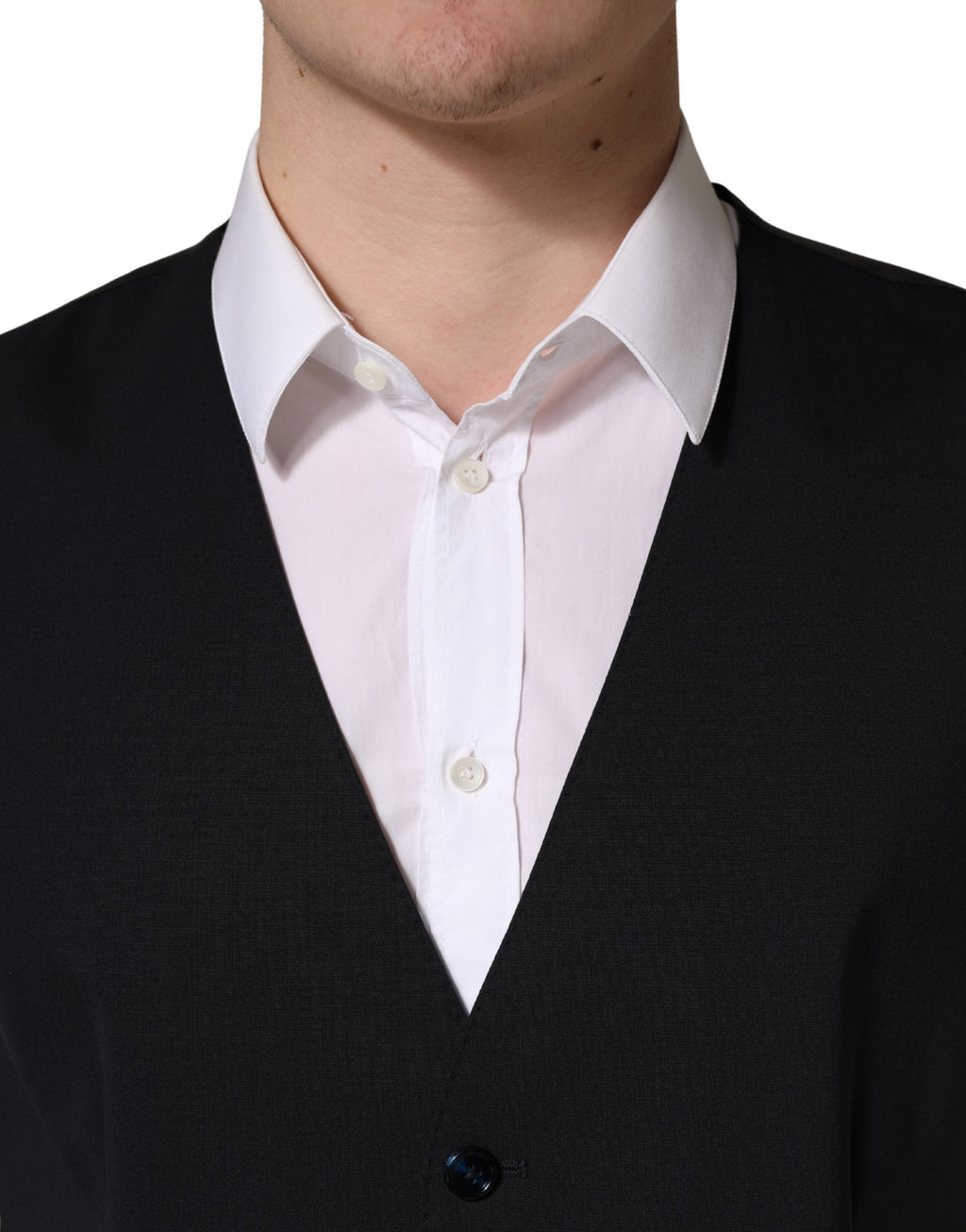 Gilet noir en laine à boutonnière simple de Dolce & Gabbana, veste masculine élégante avec col et poches latérales.