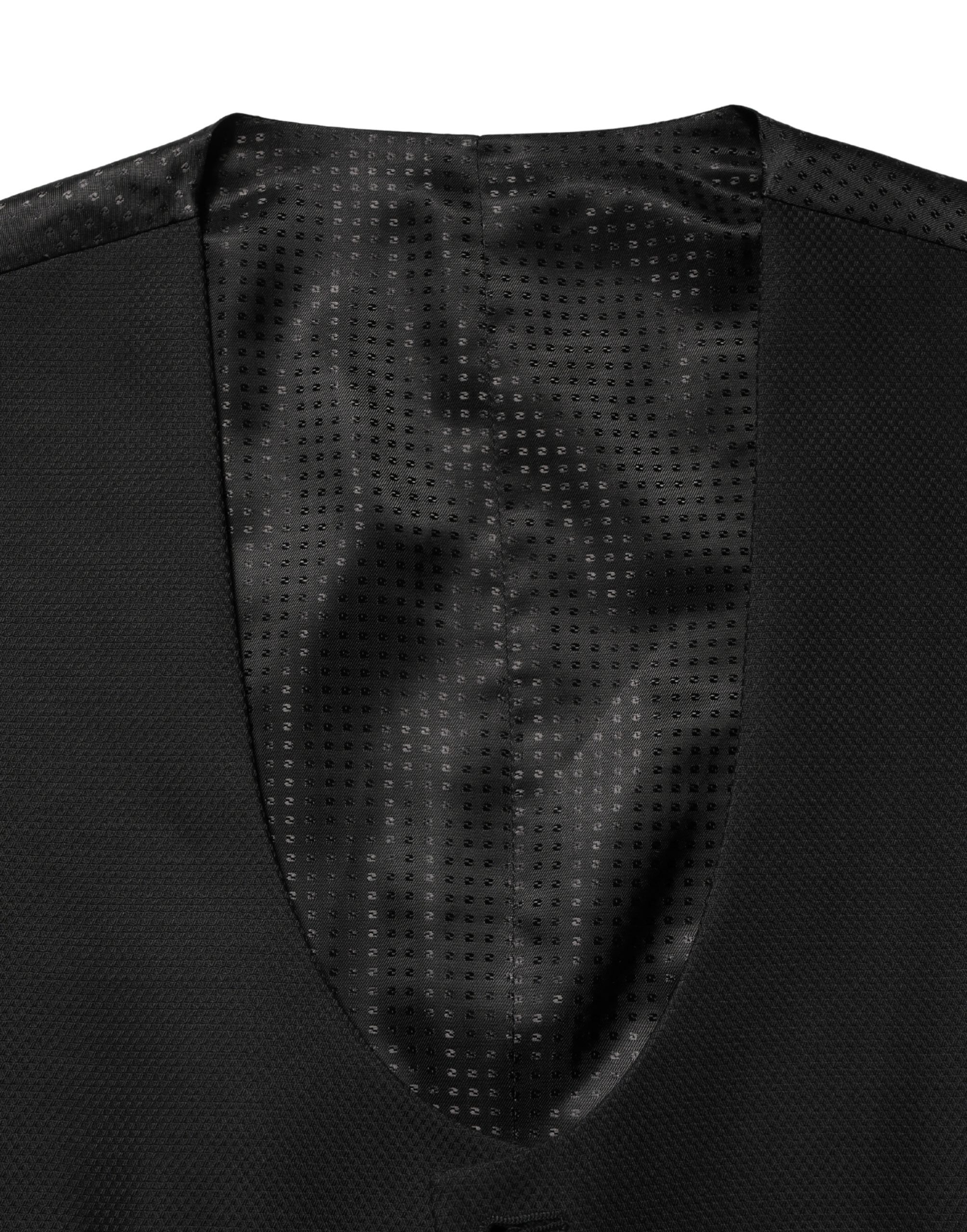 Gilet en laine noire Dolce & Gabbana à manches longues, à col en V et à boutonnière simple, porté sur un mannequin.