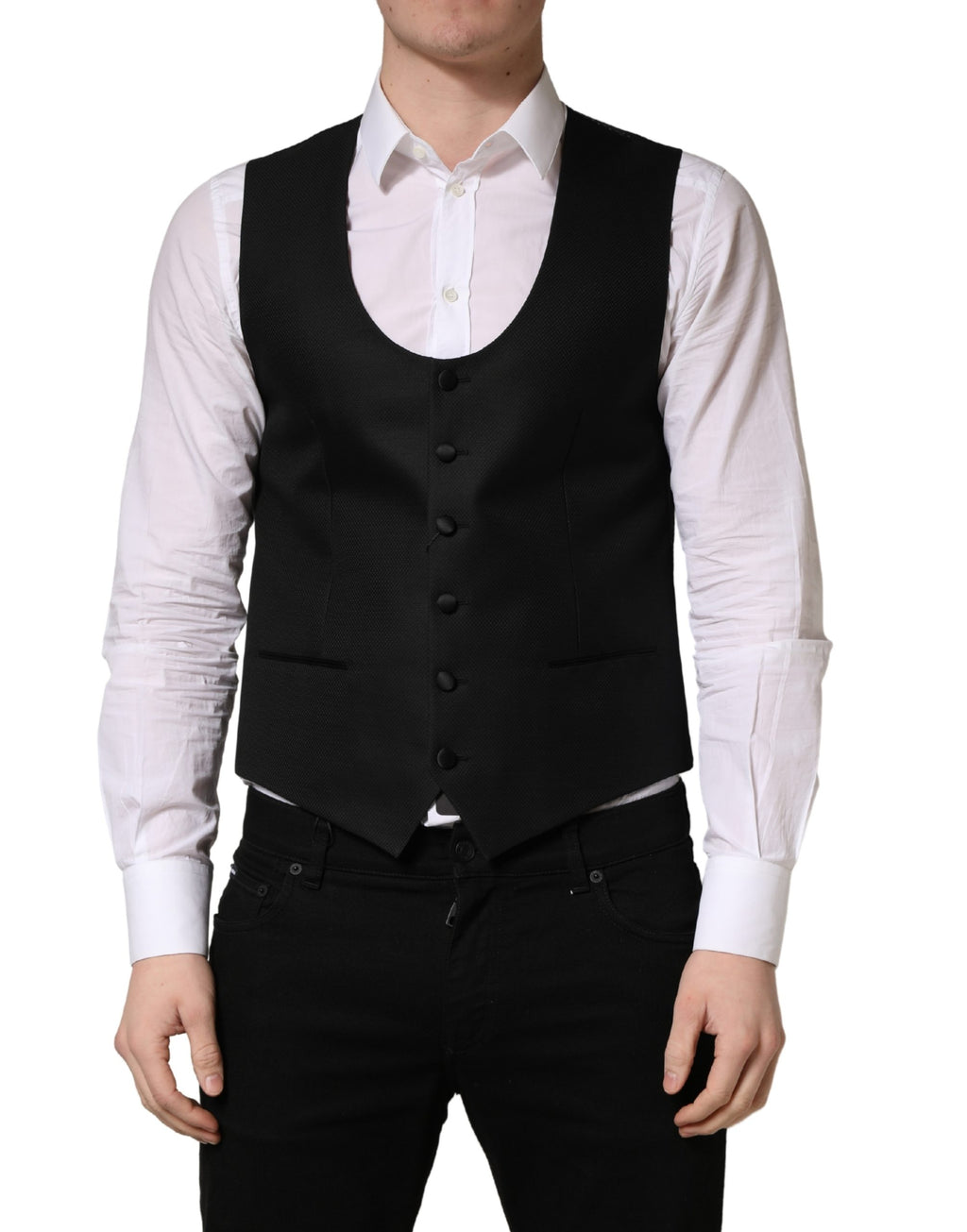 Gilet noir en laine Dolce & Gabbana à un seul bouton, coupe ajustée, détails élégants, porté sur un mannequin.