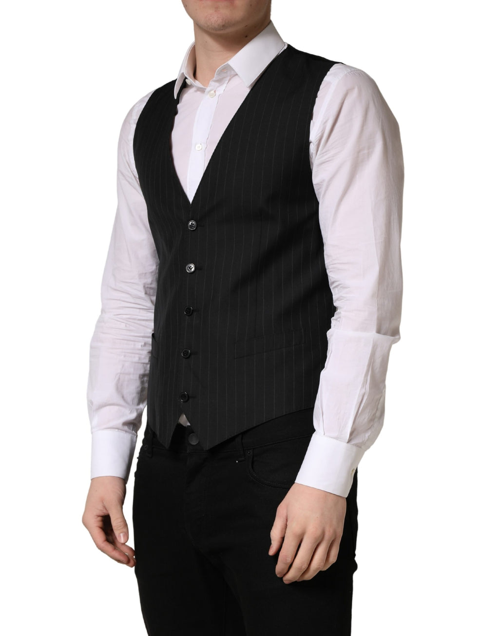 Gilet noir à rayures Dolce & Gabbana, à simple boutonnage, en tissu élégant, porté sur un fond neutre.