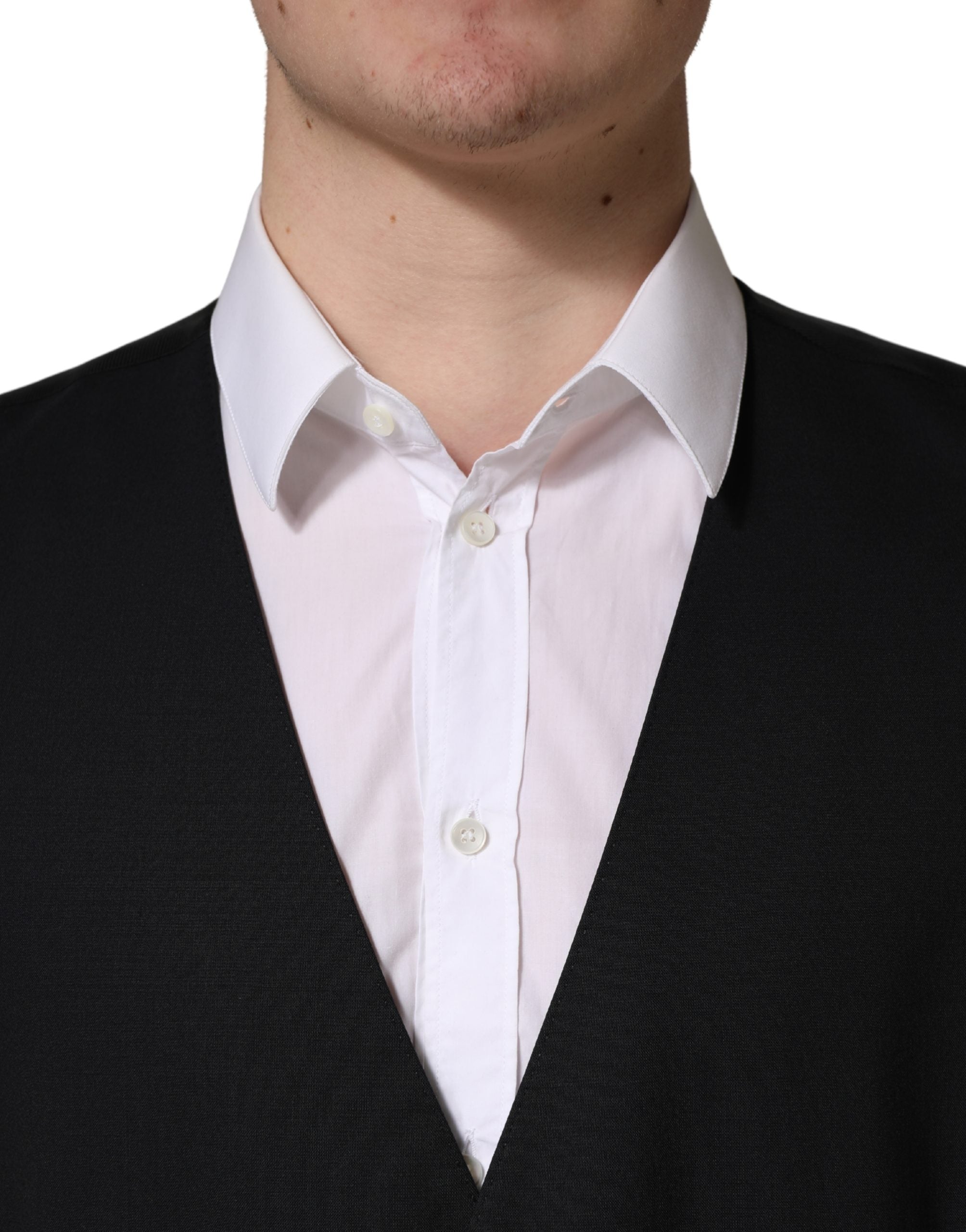 Gilet noir en laine à simple boutonnage de Dolce & Gabbana, vestiaire élégant pour homme avec col et boutons visibles.