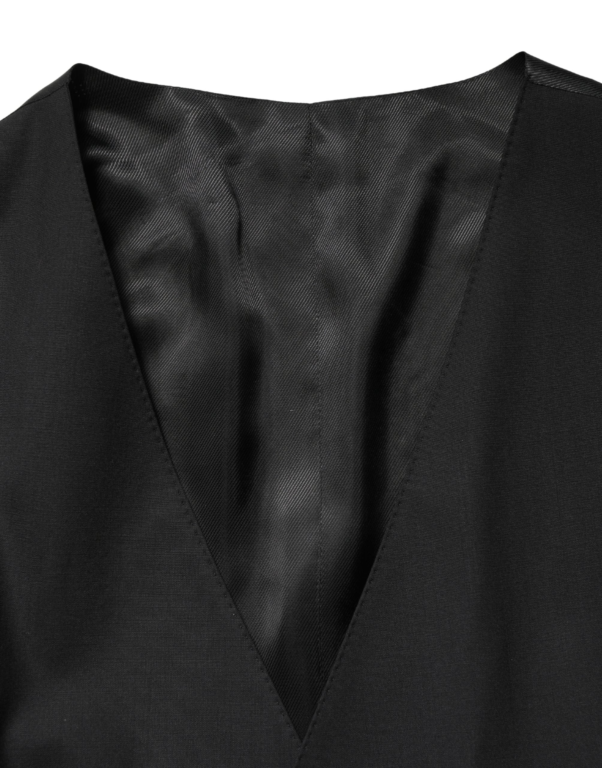 Gilet en laine noire Dolce & Gabbana à simple boutonnage, élégant et ajusté, porté sur un mannequin.