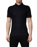 Polo homme en soie bleu foncé de Dolce & Gabbana avec manches courtes et col classique, porté sur un mannequin.