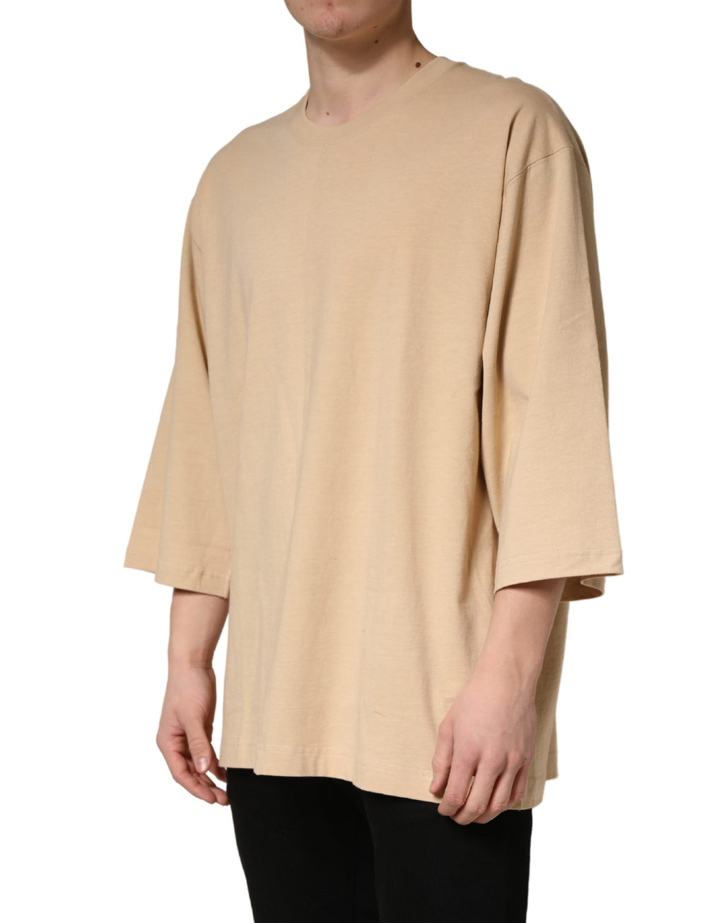 T-shirt beige en coton Dolce & Gabbana à col rond, coupe oversize, vue de face sur fond neutre.