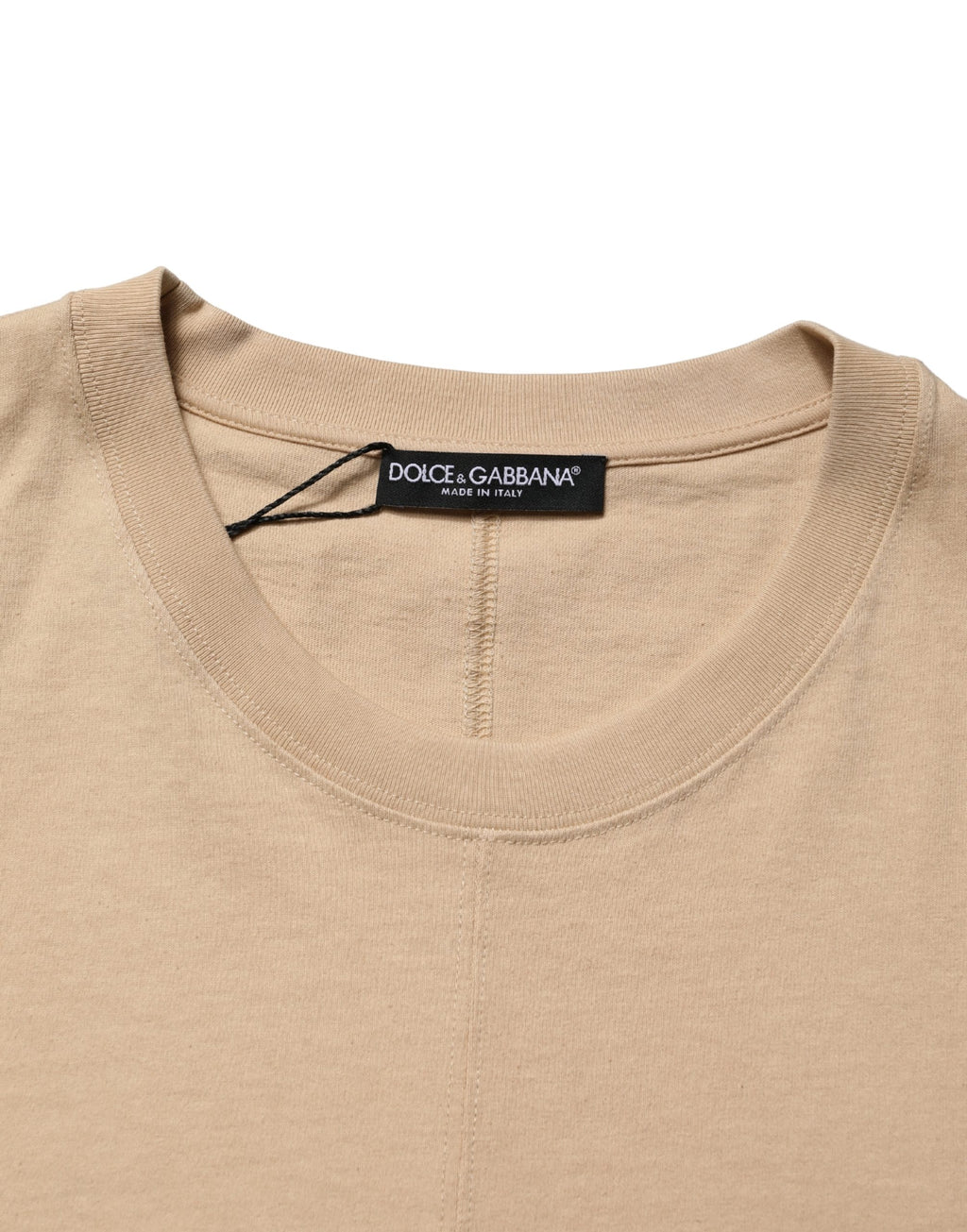 T-shirt beige en coton Dolce & Gabbana à col rond, coupe oversize, vue de face, détails du tissu et style décontracté.