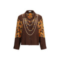 Chemise en tissu marron avec motif de la marque Versace, détail de style élégant et sophistiqué.