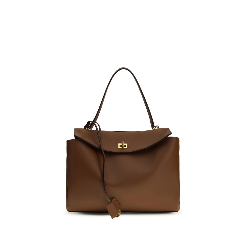 Sac à bandoulière Balenciaga en cuir de veau marron Bos Taurus, élégant et sophistiqué, visible avec ses détails et sa texture.
