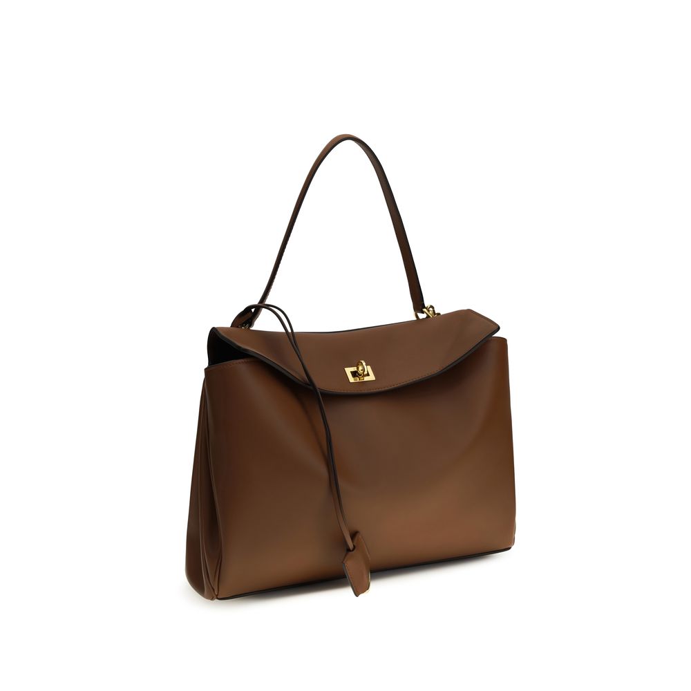 Sac à bandoulière Balenciaga en cuir de veau marron Bos Taurus, élégant et sophistiqué, avec détails raffinés.