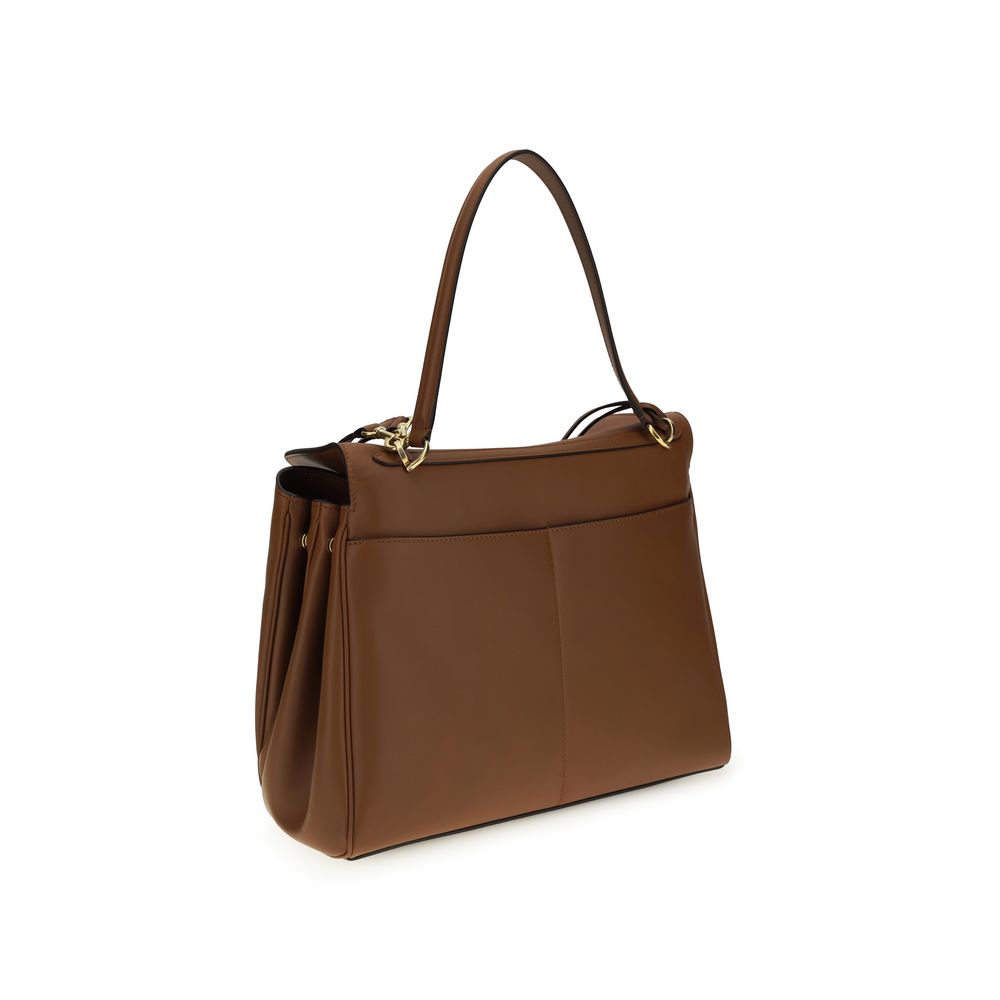 Sac à épaule Balenciaga Bos Taurus en cuir de veau marron, élégant et sophistiqué, avec détails en finition de haute qualité.