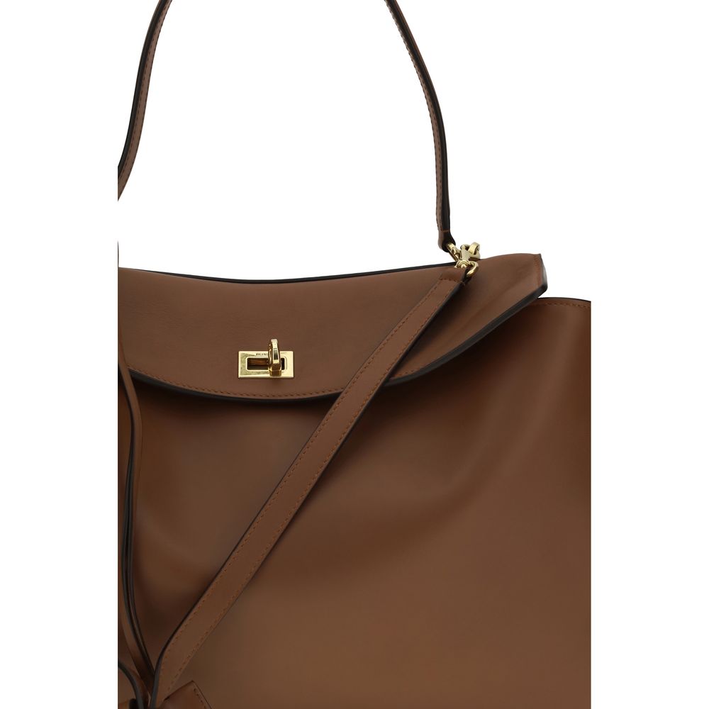 Sac à épaule Balenciaga Bos Taurus en cuir de veau marron, élégant et sophistiqué, avec détails soignés et finition de haute qualité.