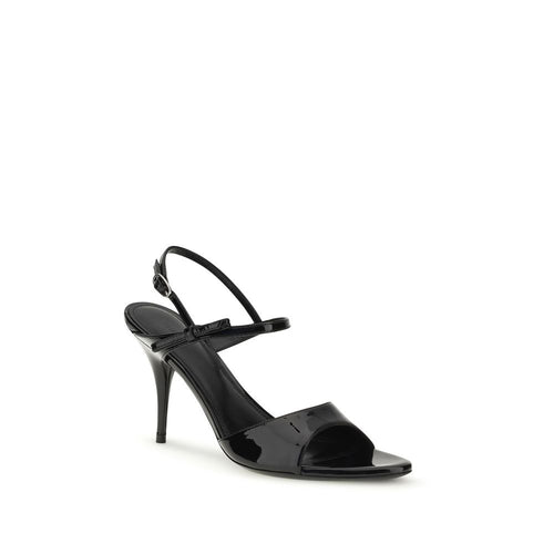 Sandales à talons stilettos Balenciaga en cuir de veau noir, modèle Bos Taurus, visibles sur l'image.