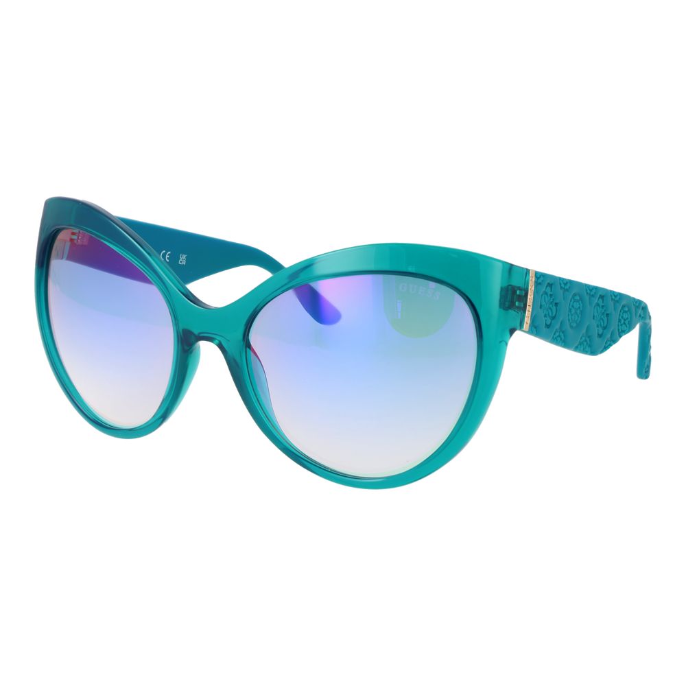 Lunettes de soleil en acier inoxydable turquoise de Guess avec monture rectangulaire et verres foncés.