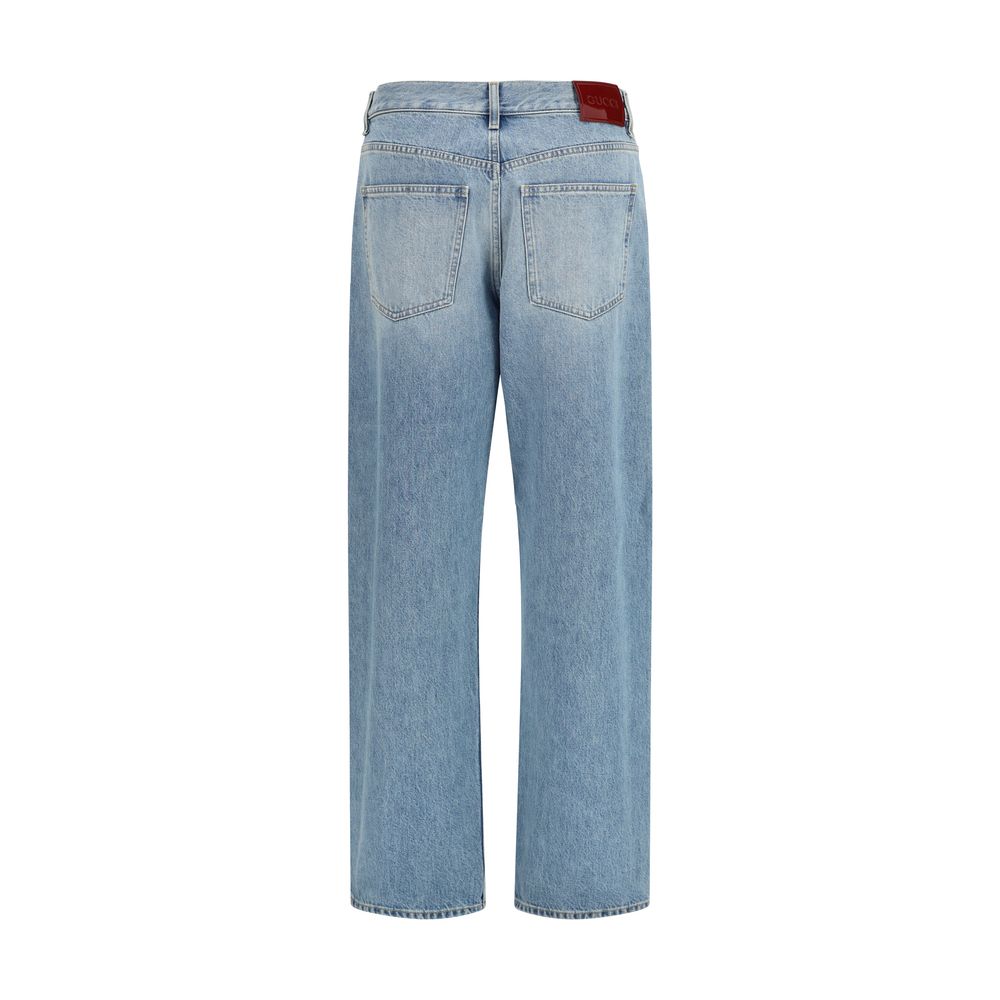 Jeans droits en coton bleu Gucci, style classique, avec ceinture et poches visibles, pour un look décontracté et élégant.